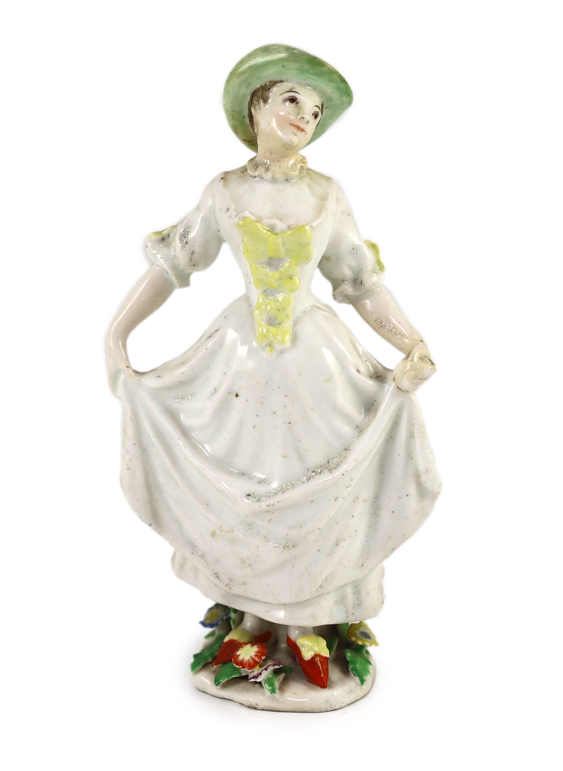 A rare Chelsea figure of a dancing girl, c.1752-55, probably modelled by Joseph Willems, 16 cm high, discoloured restoration